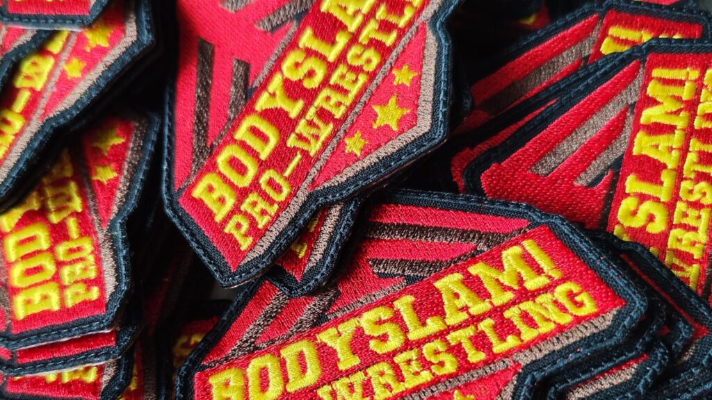 Custom embroidered logo patches produced in our Mottopatch EU workshop